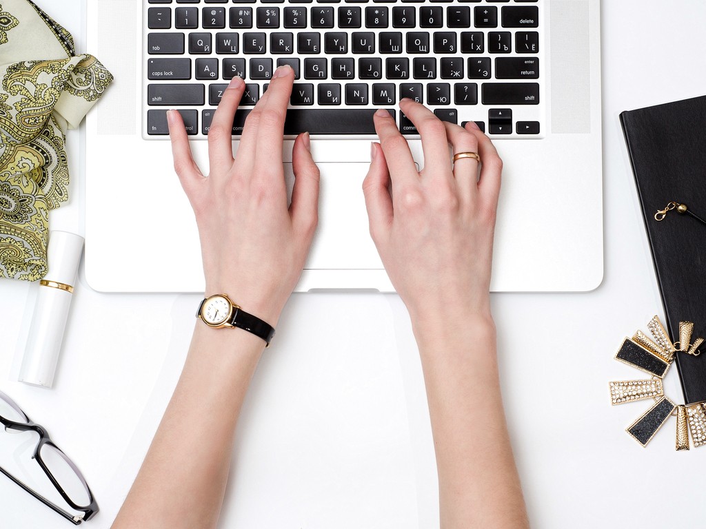 Woman working on video content on laptop